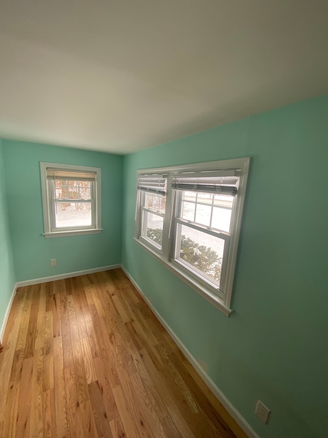 unfurnished room featuring light hardwood / wood-style flooring