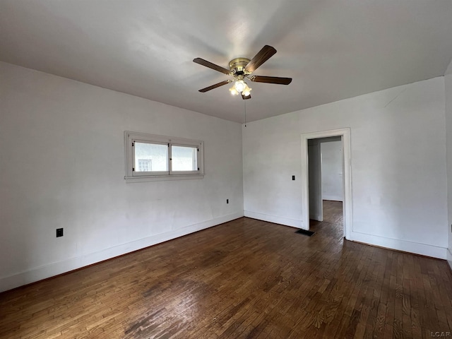 empty room featuring ceiling fan and dark hardwood / wood-style flooring