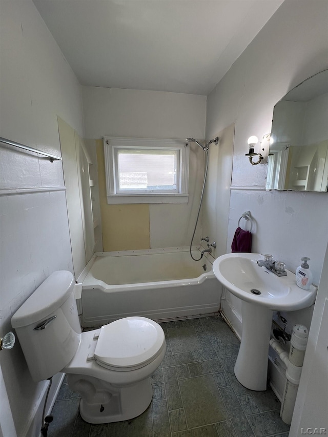 bathroom featuring toilet and shower / washtub combination