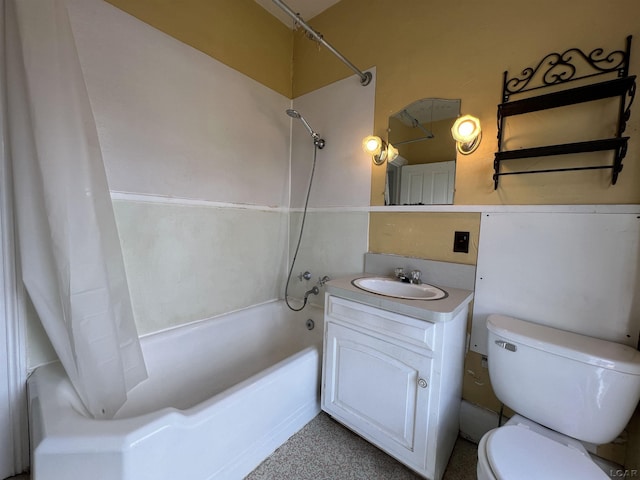 full bathroom featuring vanity, shower / bath combo, and toilet