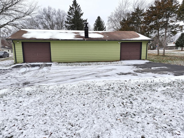 view of snow covered garage