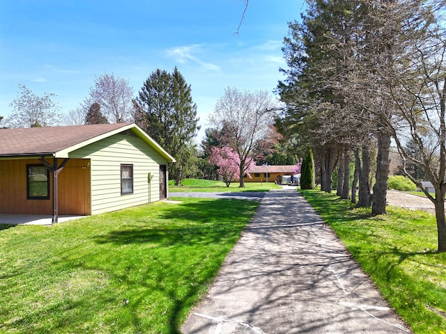 view of side of home featuring a yard