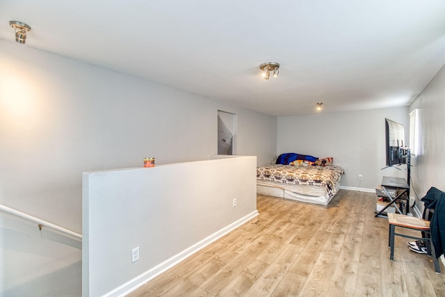 bedroom with light hardwood / wood-style flooring