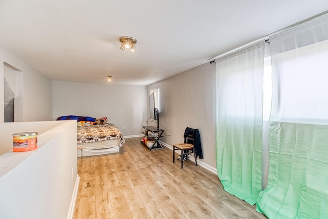 bedroom with light hardwood / wood-style flooring