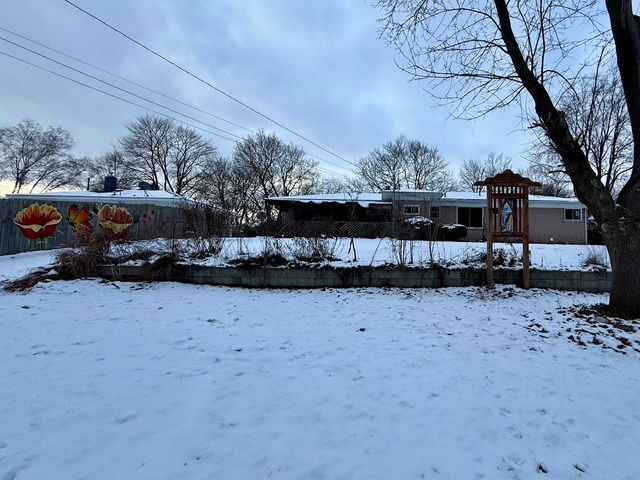 view of yard covered in snow