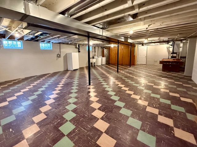 basement with washing machine and dryer and sink