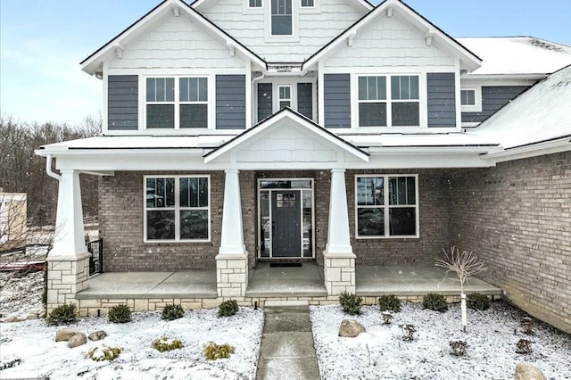 craftsman inspired home featuring covered porch