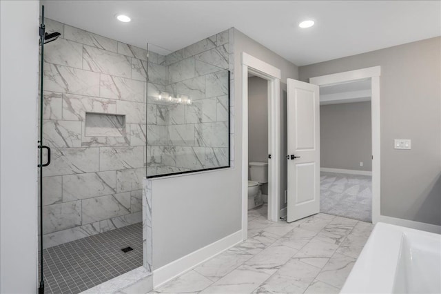 bathroom with tiled shower and toilet