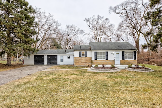 ranch-style home featuring a front yard and a garage