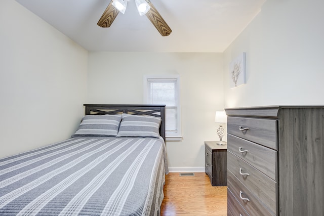 bedroom with ceiling fan and light wood-type flooring