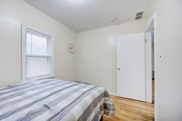 bedroom with light hardwood / wood-style flooring