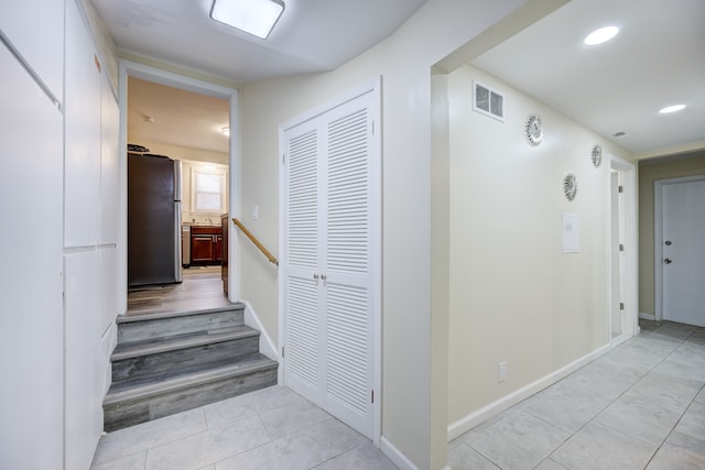 hallway with light tile patterned flooring