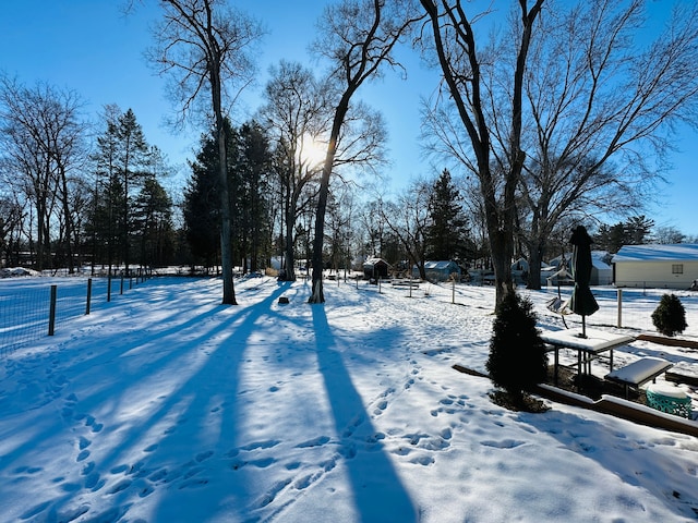 view of yard layered in snow