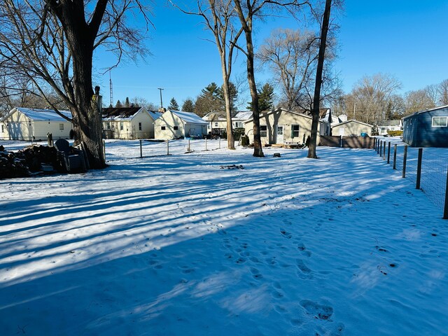 view of yard layered in snow