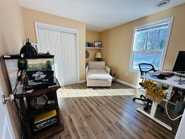 office space with hardwood / wood-style floors