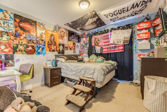 bedroom featuring light colored carpet