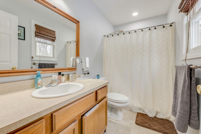 bathroom with tile patterned floors, vanity, and toilet