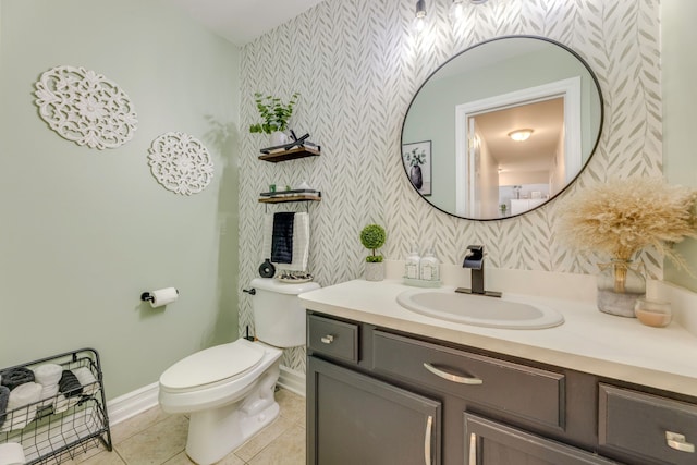 bathroom featuring tile patterned floors, vanity, and toilet