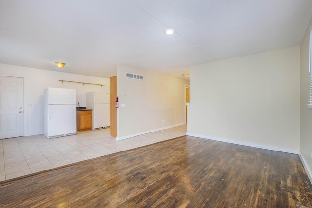 unfurnished room featuring light hardwood / wood-style floors