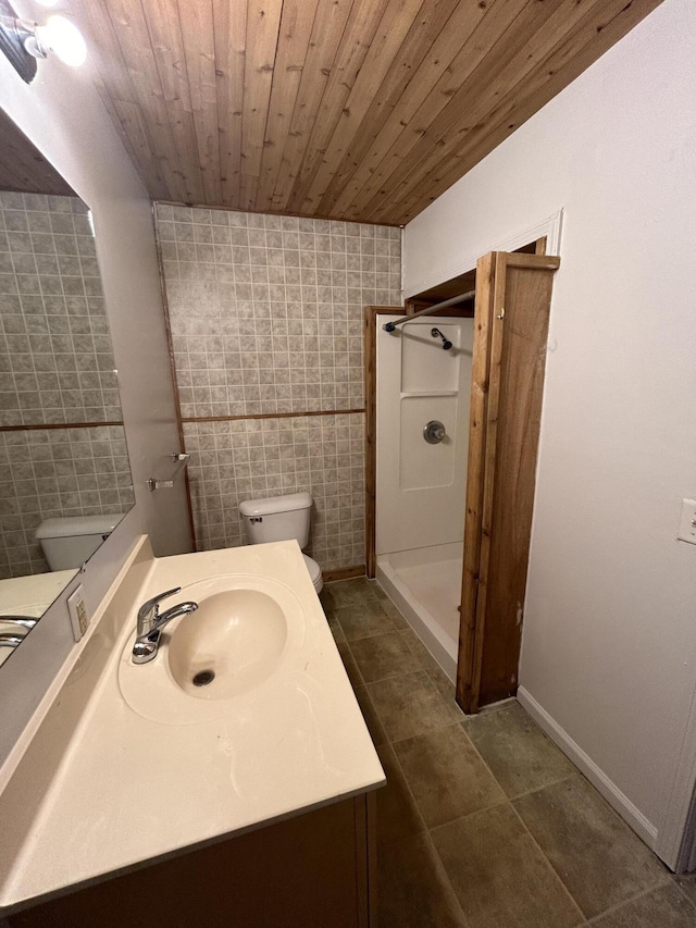 bathroom with vanity, toilet, walk in shower, and wood ceiling