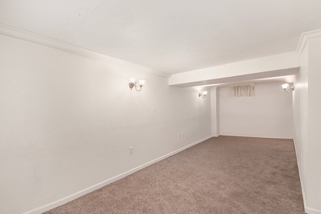 basement with carpet floors and ornamental molding