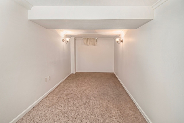 interior space featuring carpet flooring and crown molding