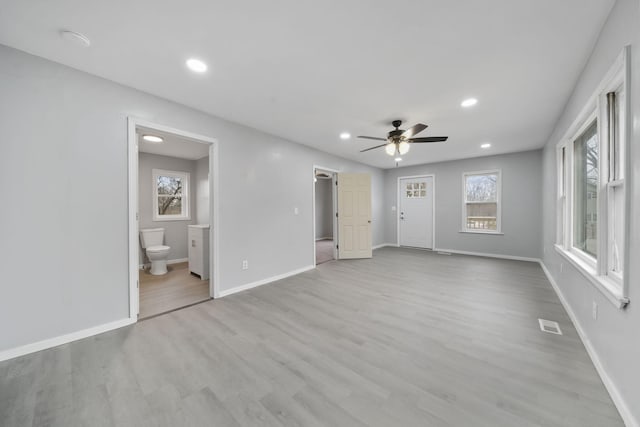 interior space featuring ceiling fan and light wood-type flooring