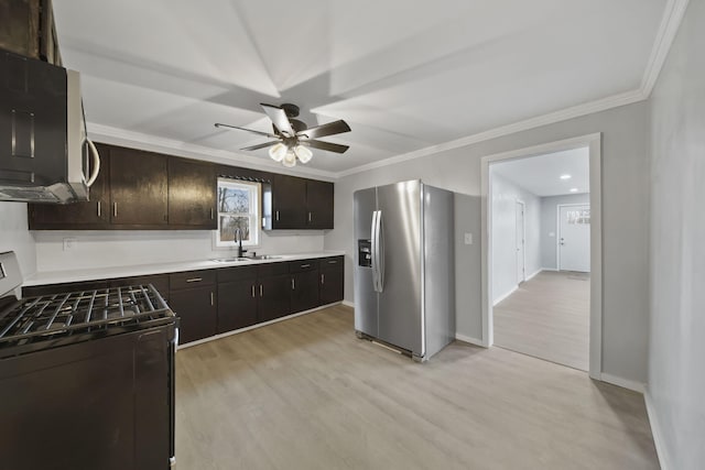 kitchen featuring range, sink, stainless steel refrigerator with ice dispenser, light wood-type flooring, and dark brown cabinetry