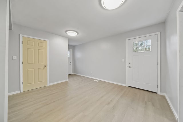 entrance foyer with light wood-type flooring