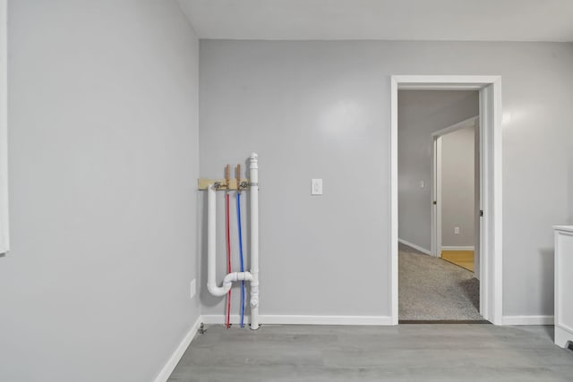 empty room with light hardwood / wood-style flooring