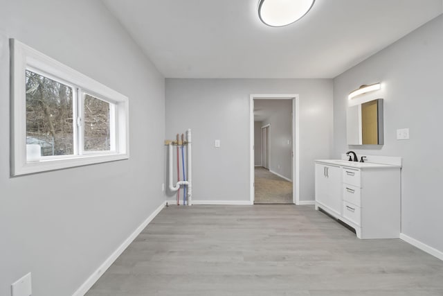 bathroom with vanity and hardwood / wood-style flooring