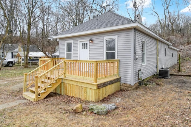 view of front of home featuring cooling unit and a wooden deck