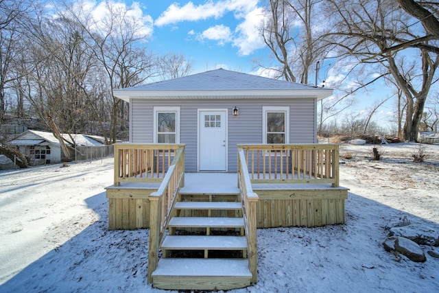 view of front of property featuring a wooden deck