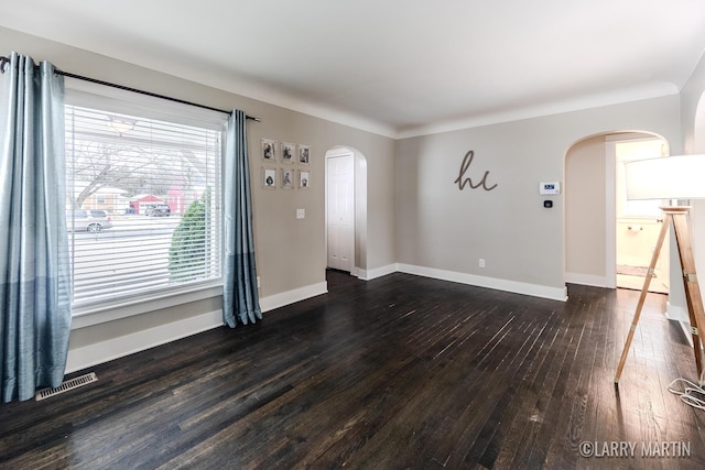 empty room with dark hardwood / wood-style floors