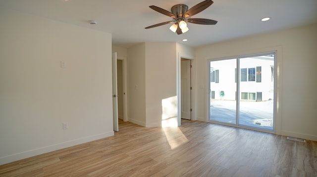 unfurnished room featuring ceiling fan and light hardwood / wood-style flooring