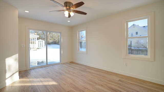 unfurnished room with ceiling fan and light hardwood / wood-style flooring