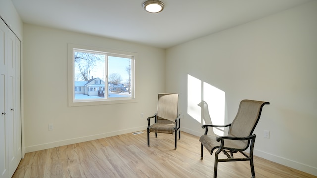 sitting room with light hardwood / wood-style floors