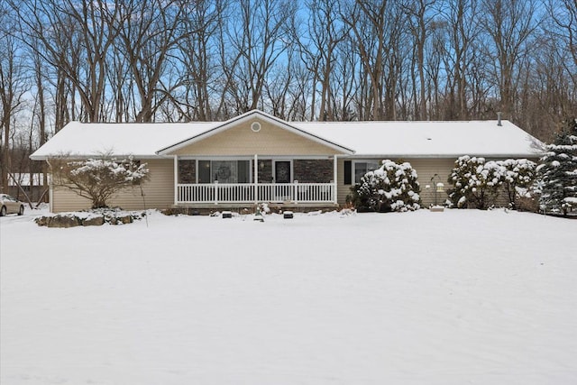 single story home with a porch