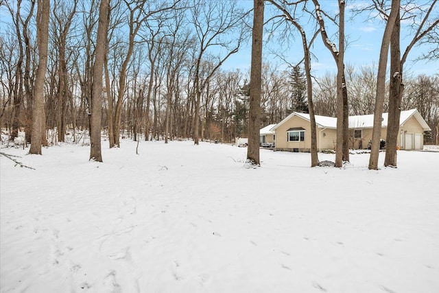 view of yard layered in snow