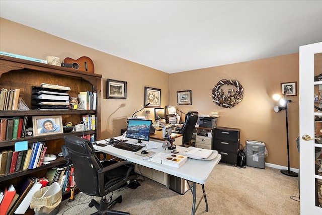 office area featuring light carpet