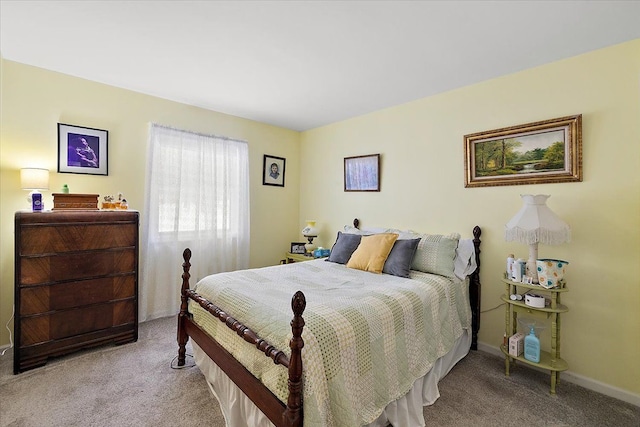 bedroom featuring light carpet