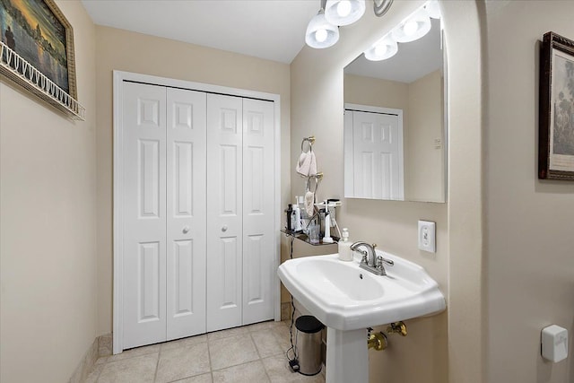 bathroom featuring tile patterned flooring and sink