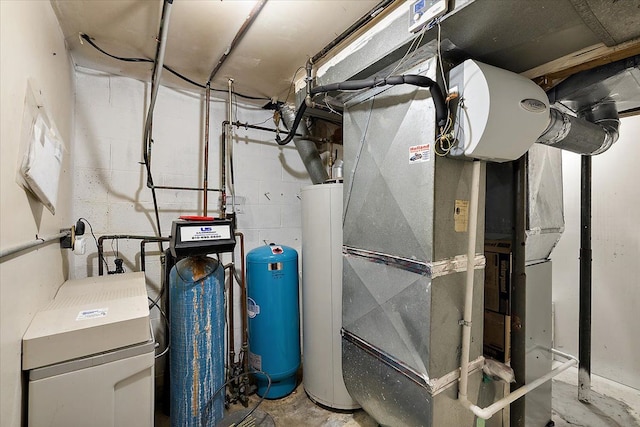 utility room featuring heating unit and gas water heater