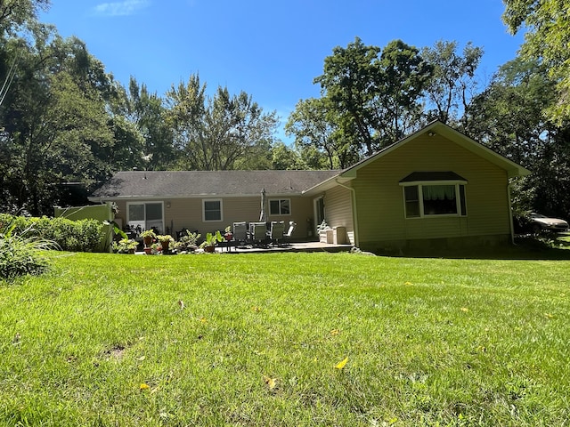 5400 Grange Hall Rd, Holly, MI 48442 - back of house with a yard and a patio area