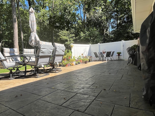 5400 Grange Hall Rd, Holly, MI 48442 - view of patio / terrace featuring outdoor dining space and a fenced backyard