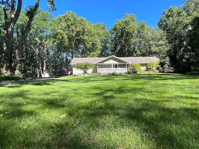 5400 Grange Hall Rd, Holly, MI 48442 - exterior space with a porch and a front yard