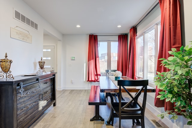 dining space featuring light hardwood / wood-style floors