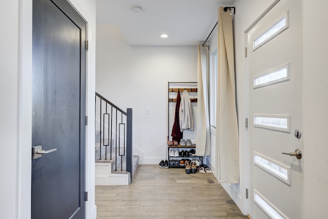 entryway with light hardwood / wood-style floors