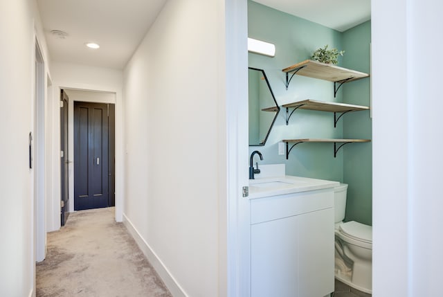 interior space with sink and light colored carpet