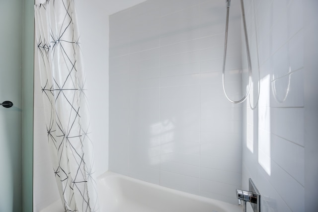 bathroom with shower / bathtub combination with curtain